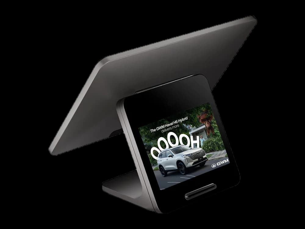 A GWM Haval H6 Hybrid ad running on a point-of-sale customer display